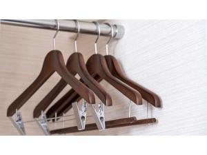 a bunch of wooden hangers hanging from a wall at Meet Inn Narita - Vacation STAY 43769v in Narita