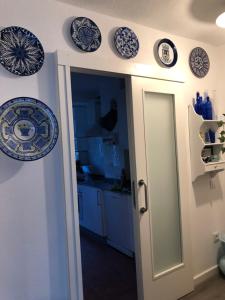 a kitchen with blue and white plates on the wall at RIA DE BELUSO in Bueu