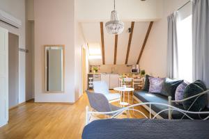 a living room with a couch and a table at Paon Boutique Apartments in Zagreb