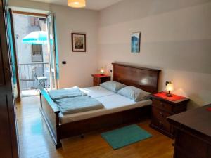 Un ou plusieurs lits dans un hébergement de l'établissement Appartamento AZZURRO