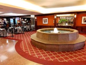 a lobby with a fountain in the middle of a restaurant at Obelisco 818 in Buenos Aires