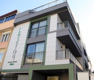 a building with balconies on the side of it at Letstay Sweet Home Mint in Antalya
