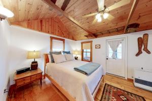 a bedroom with a bed and a ceiling fan at Little Birch in Gray