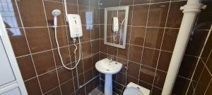Koupelna v ubytování Misto Hotel