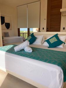 Postel nebo postele na pokoji v ubytování Tikul Hotel Boutique