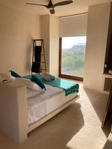 Postel nebo postele na pokoji v ubytování Tikul Hotel Boutique