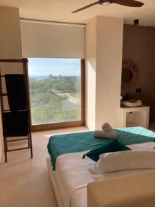 Postel nebo postele na pokoji v ubytování Tikul Hotel Boutique