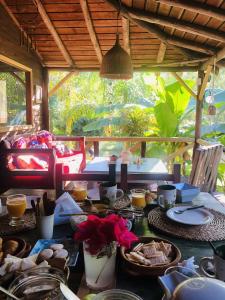 a table with plates of food on top of it at Cabañas AlRío Quietud en Movimiento in Tigre