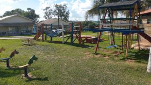 a park with a playground with a slide at Campo Belo Resort in Álvares Machado