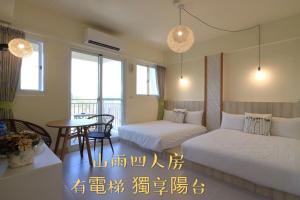 Postel nebo postele na pokoji v ubytování 花蓮雲朵朵民宿 電梯附停車場