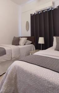 Postel nebo postele na pokoji v ubytování Maya Homestay Putrajaya