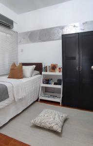 Postel nebo postele na pokoji v ubytování Maya Homestay Putrajaya