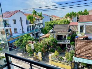 a view of a city from a balcony at Little Boss Homestay in Hoi An