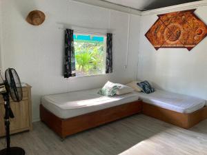 Un ou plusieurs lits dans un hébergement de l'établissement Manomano Lodge