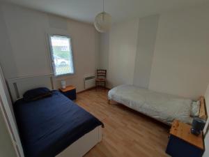 Postel nebo postele na pokoji v ubytování Gîte F4