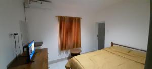 Ένα ή περισσότερα κρεβάτια σε δωμάτιο στο The Balisunny House