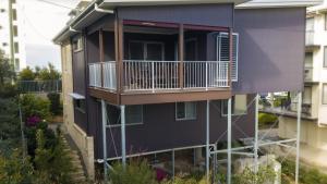 an exterior view of a building with a balcony at Saltys Place, Pet Friendly and Close To Beach in Caloundra
