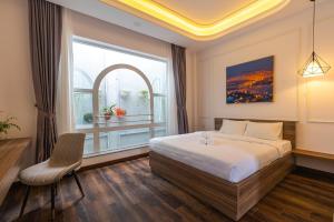 Postel nebo postele na pokoji v ubytování MSing DaLat Hotel