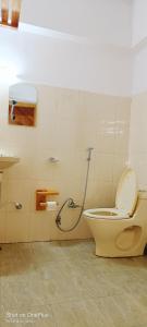 a bathroom with a toilet and a shower at Hotel Himalayan Galaxy in Chakrāta