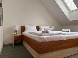 Postel nebo postele na pokoji v ubytování Tišnovská Rychta
