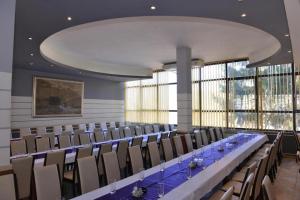 a large room with a long table and chairs at Motel Park Rogatica in Rogatica