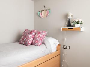 A bed or beds in a room at La Casa de Estrella