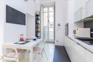 Kuchyň nebo kuchyňský kout v ubytování Pura Vida Duplex by Wonderful Italy