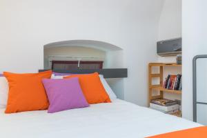Postel nebo postele na pokoji v ubytování Pura Vida Duplex by Wonderful Italy