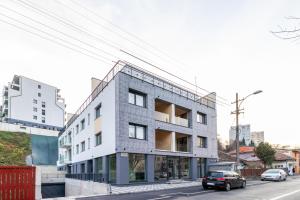 a rendering of a building on a street at Arena Residence in Cluj-Napoca