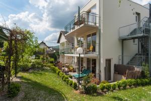 an image of a house with a yard at Ferienresidenz Brauneberger Hof in Brauneberg
