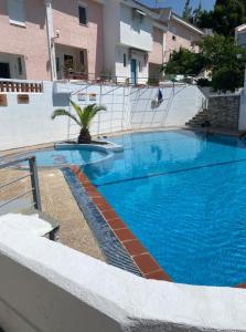 a large blue swimming pool in a building at Mina House Siviri in Siviri