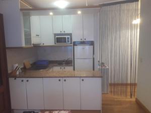 Kuchyňa alebo kuchynka v ubytovaní Apartamento Surf Beach Loredo