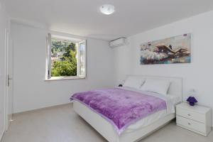 Posteľ alebo postele v izbe v ubytovaní Apartments Fortinia Dubrovnik- FREE PARKING