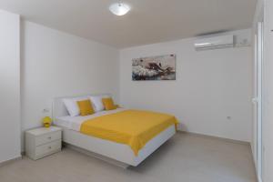 Posteľ alebo postele v izbe v ubytovaní Apartments Fortinia Dubrovnik- FREE PARKING