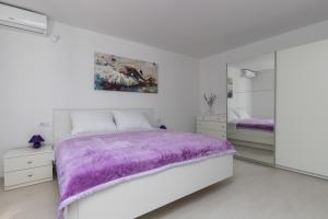 Posteľ alebo postele v izbe v ubytovaní Apartments Fortinia Dubrovnik- FREE PARKING