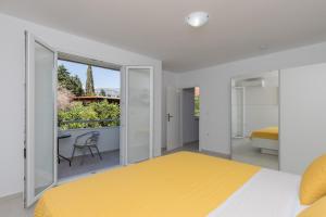 Posteľ alebo postele v izbe v ubytovaní Apartments Fortinia Dubrovnik- FREE PARKING