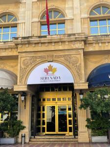 a building with a sign on the front of it at Serenada Golden Palace - Boutique Hotel in Beirut