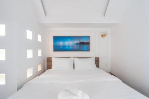 Postel nebo postele na pokoji v ubytování MSing DaLat Hotel