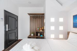 Postel nebo postele na pokoji v ubytování MSing DaLat Hotel