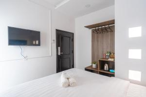 Postel nebo postele na pokoji v ubytování MSing DaLat Hotel