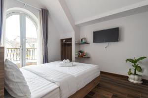 TV a/nebo společenská místnost v ubytování MSing DaLat Hotel