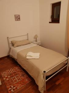 Tempat tidur dalam kamar di Dimora Marila