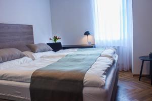 Postel nebo postele na pokoji v ubytování Hotel Diana