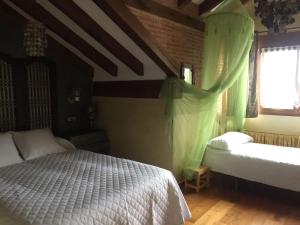 A bed or beds in a room at Camino a Casa - Suances