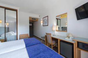 Ένα ή περισσότερα κρεβάτια σε δωμάτιο στο Varzinn Hotel