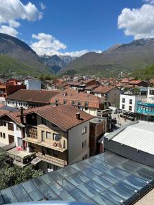 a view of a city with mountains in the background at Apartment Alpi in Peje