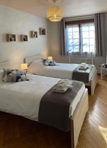 Ein Bett oder Betten in einem Zimmer der Unterkunft Entre Vignes et Détente
