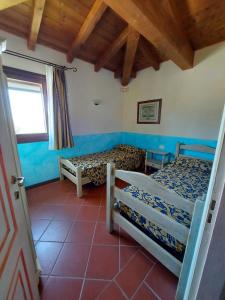 Ένα ή περισσότερα κρεβάτια σε δωμάτιο στο Villa Macchia Blu +16 φωτογραφίες