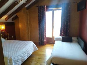 A bed or beds in a room at Camino a Casa - Suances