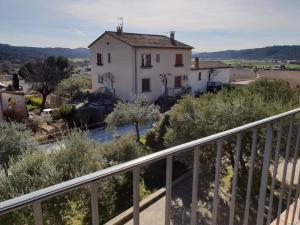 a house on a hill with a balcony at Résidence Lou Cigaloun - ANA LOCATION in Gréoux-les-Bains